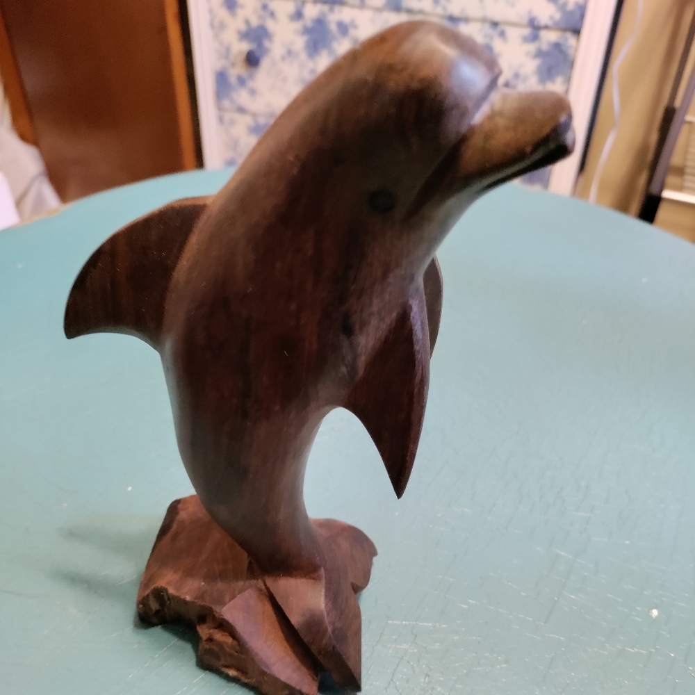 Wood dolphin statue